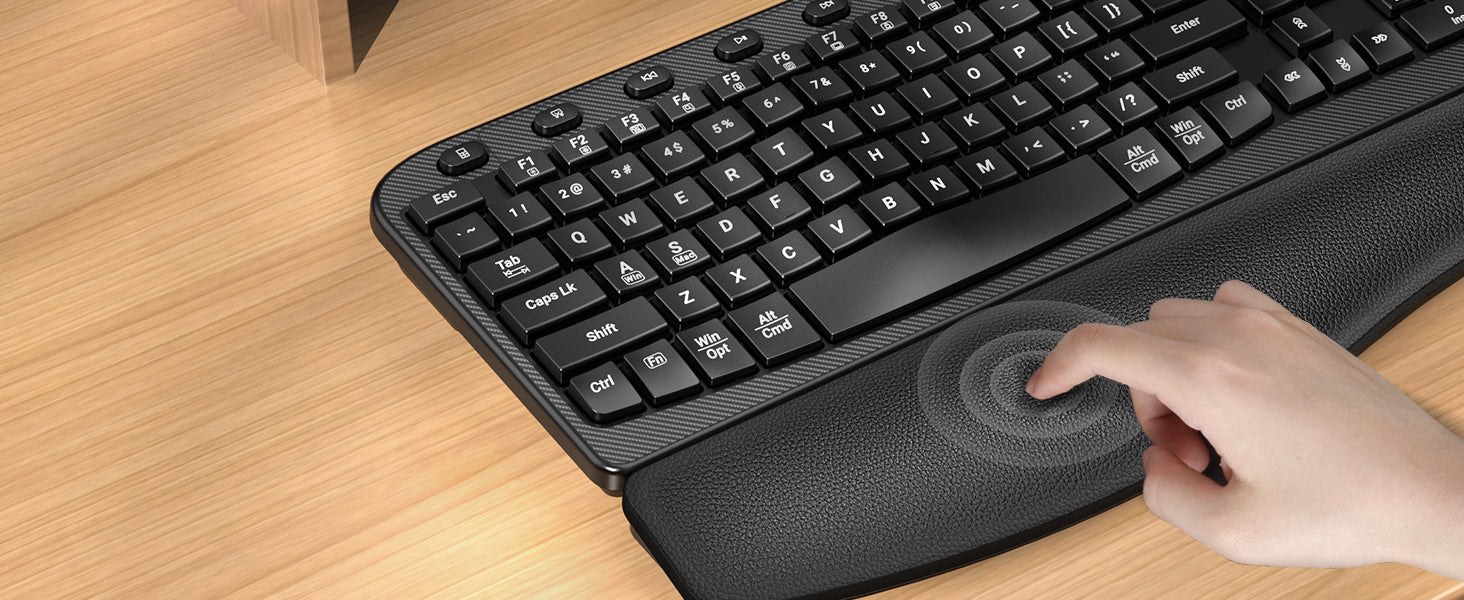 Sablute Black ergonomic keyboard with wave keys, wrist rest on a wooden surface